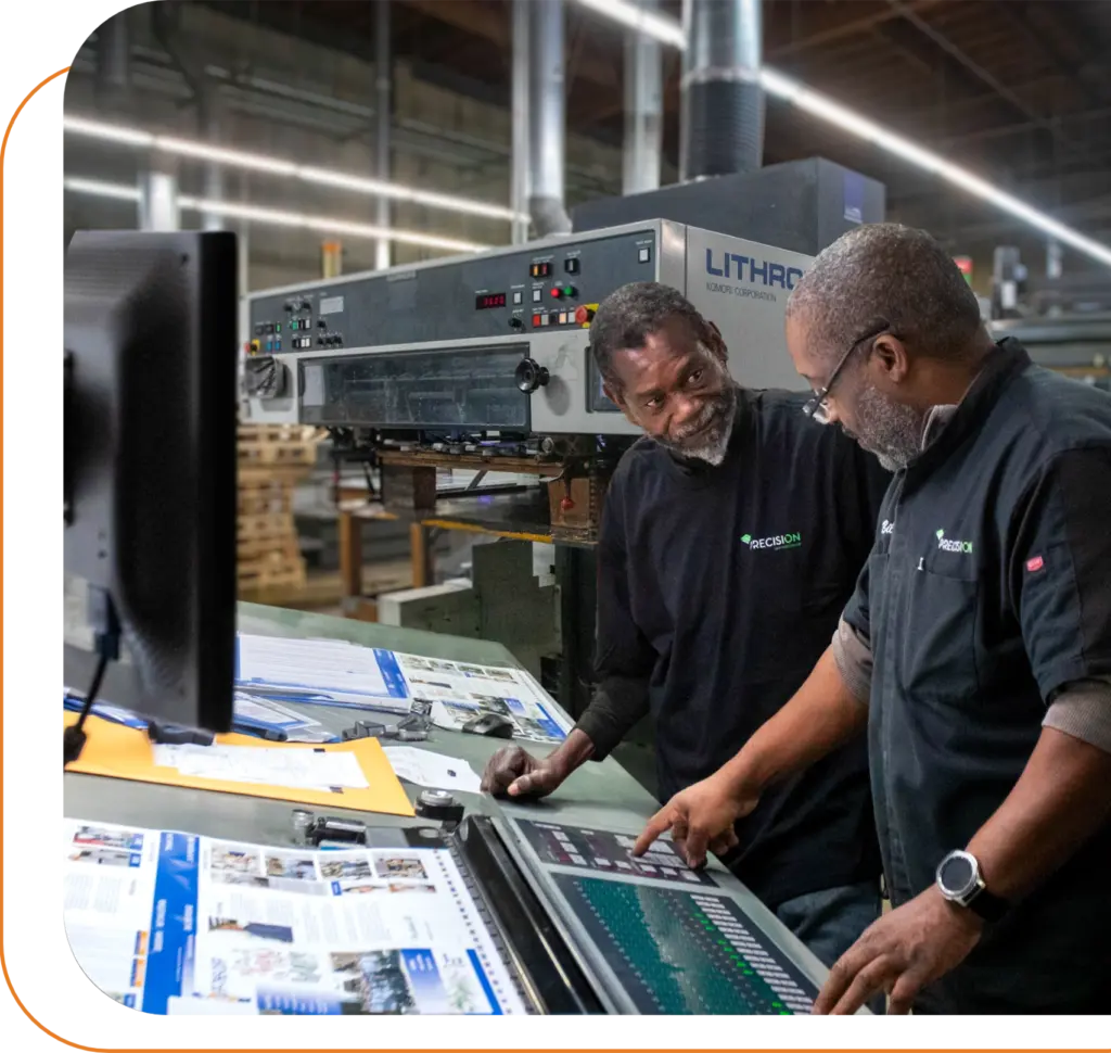 2 workers overseeing print job